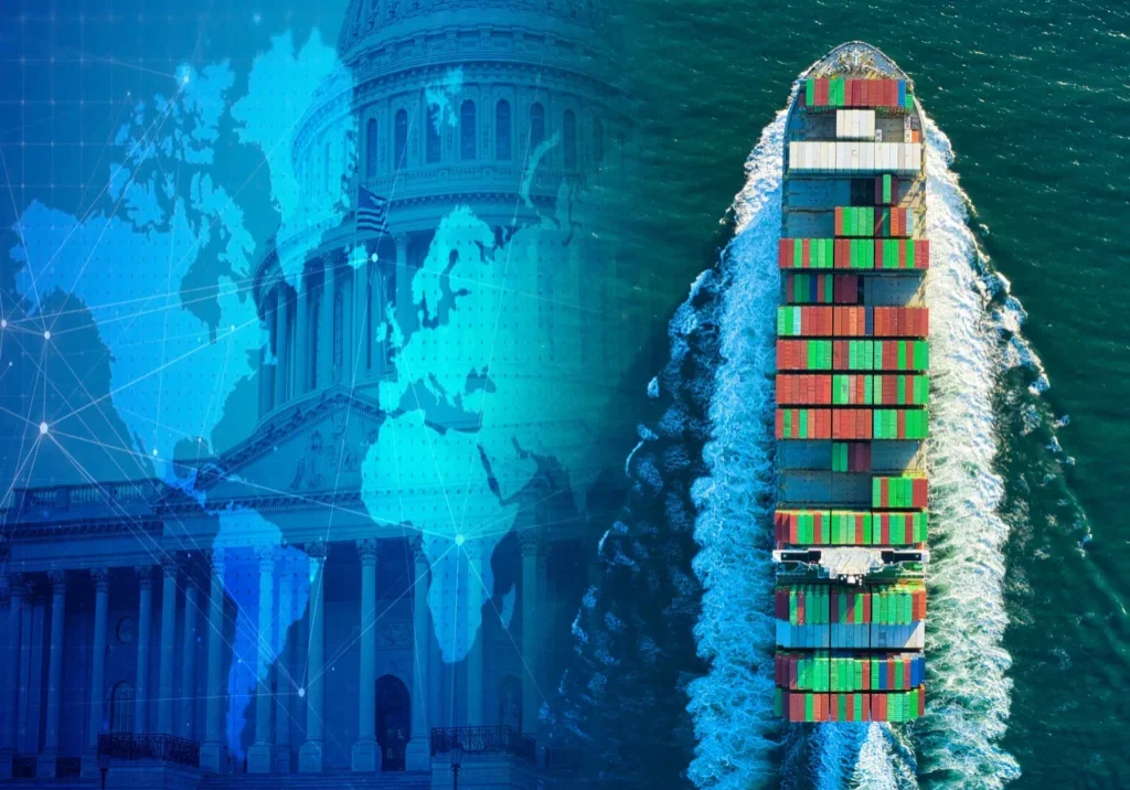Container ship passing by a government building at night.
